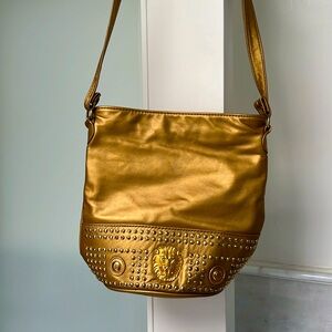 Gold color custom-made bag with lion’s head emblem, pocket in the back & inside